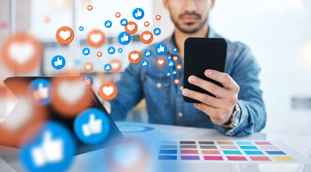 notification, phone and businessman on social media networking as communication with overlay or graphic like. digital, heart emoji and employee or worker texting on a mobile app, website or web - 移動(dòng)數(shù)字營(yíng)銷 個(gè)照片及圖片檔